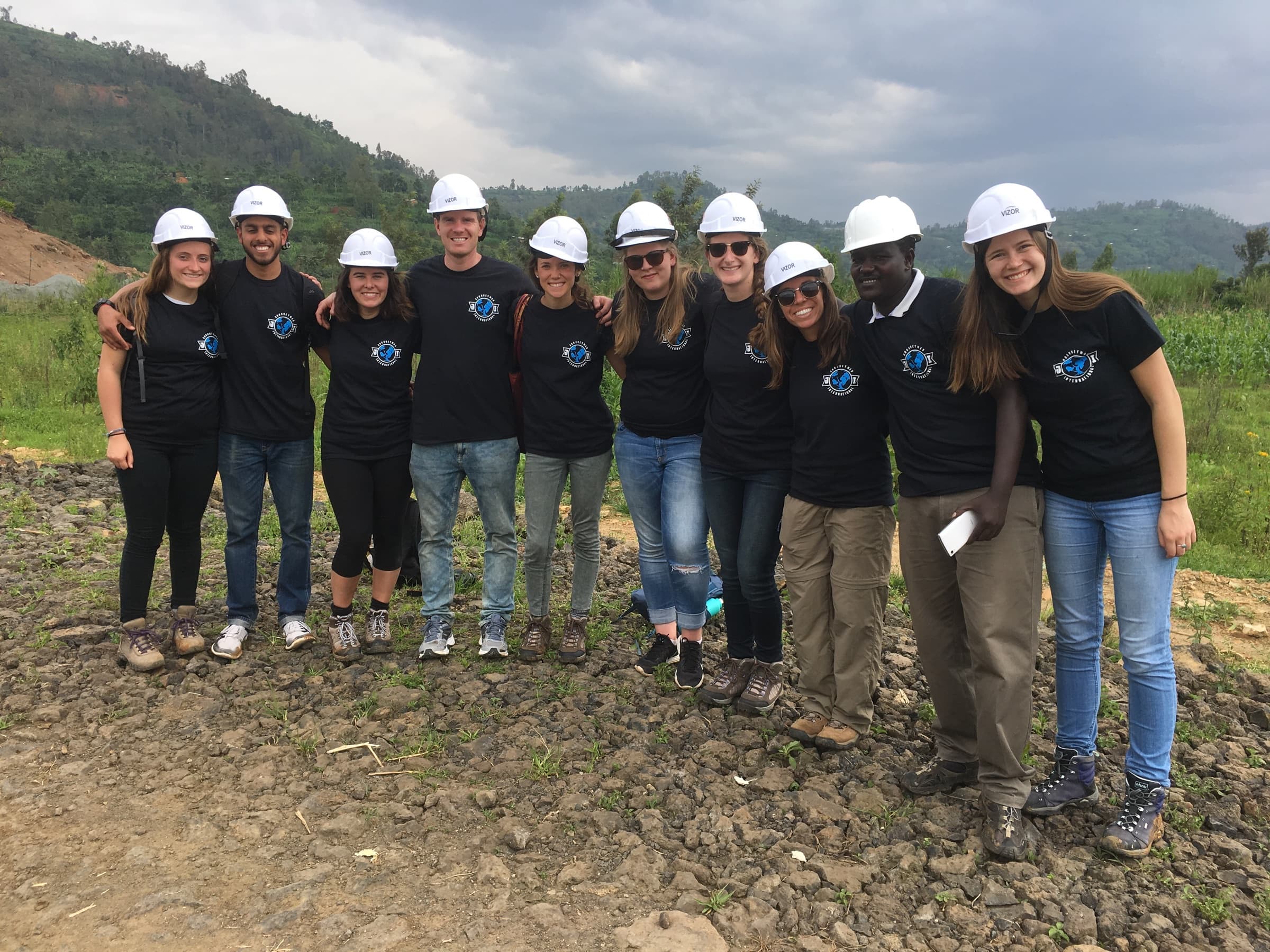 Journeyman International volunteers visiting a project site in Rwanda