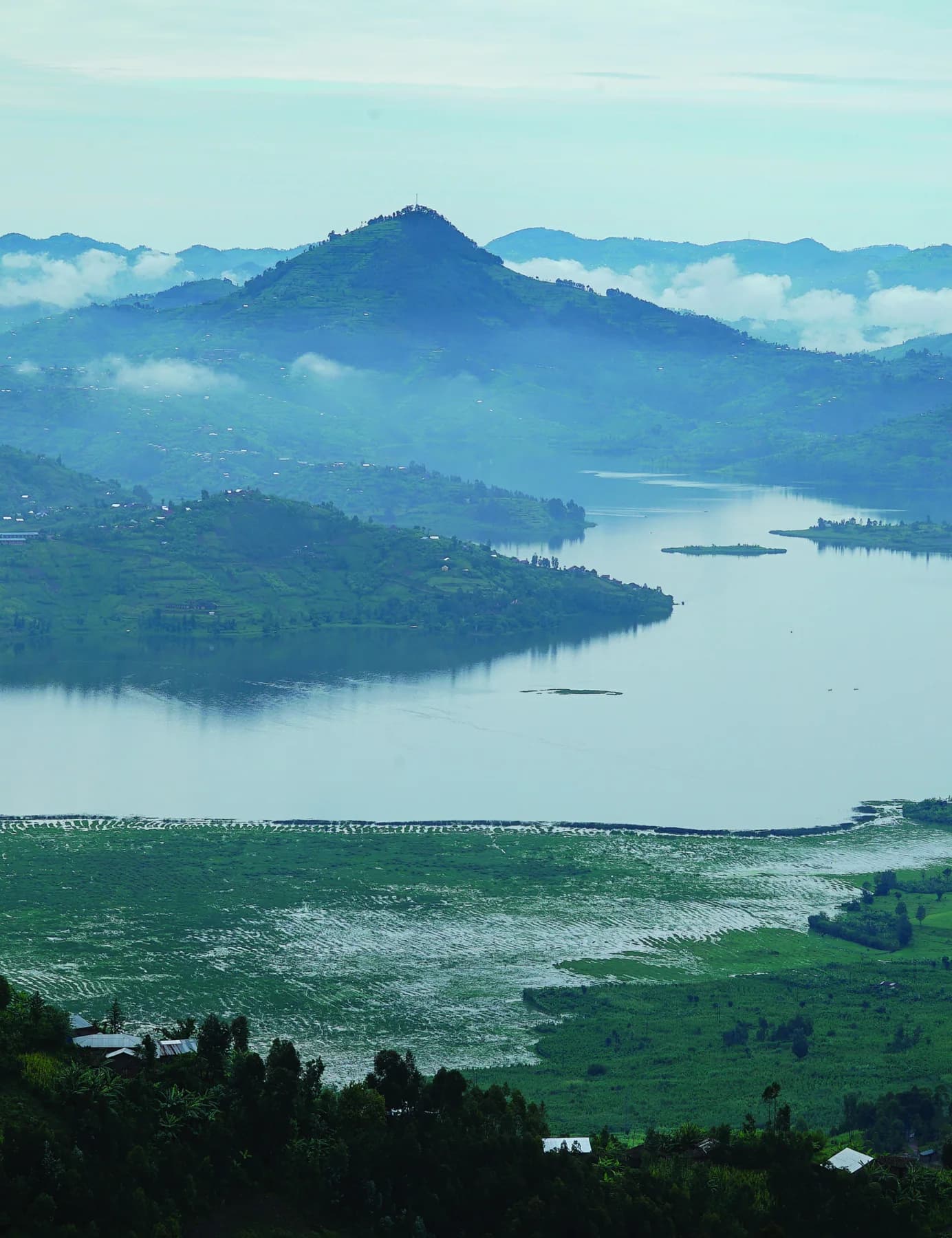A cultivated landscape surrounding a lake in Rwanda