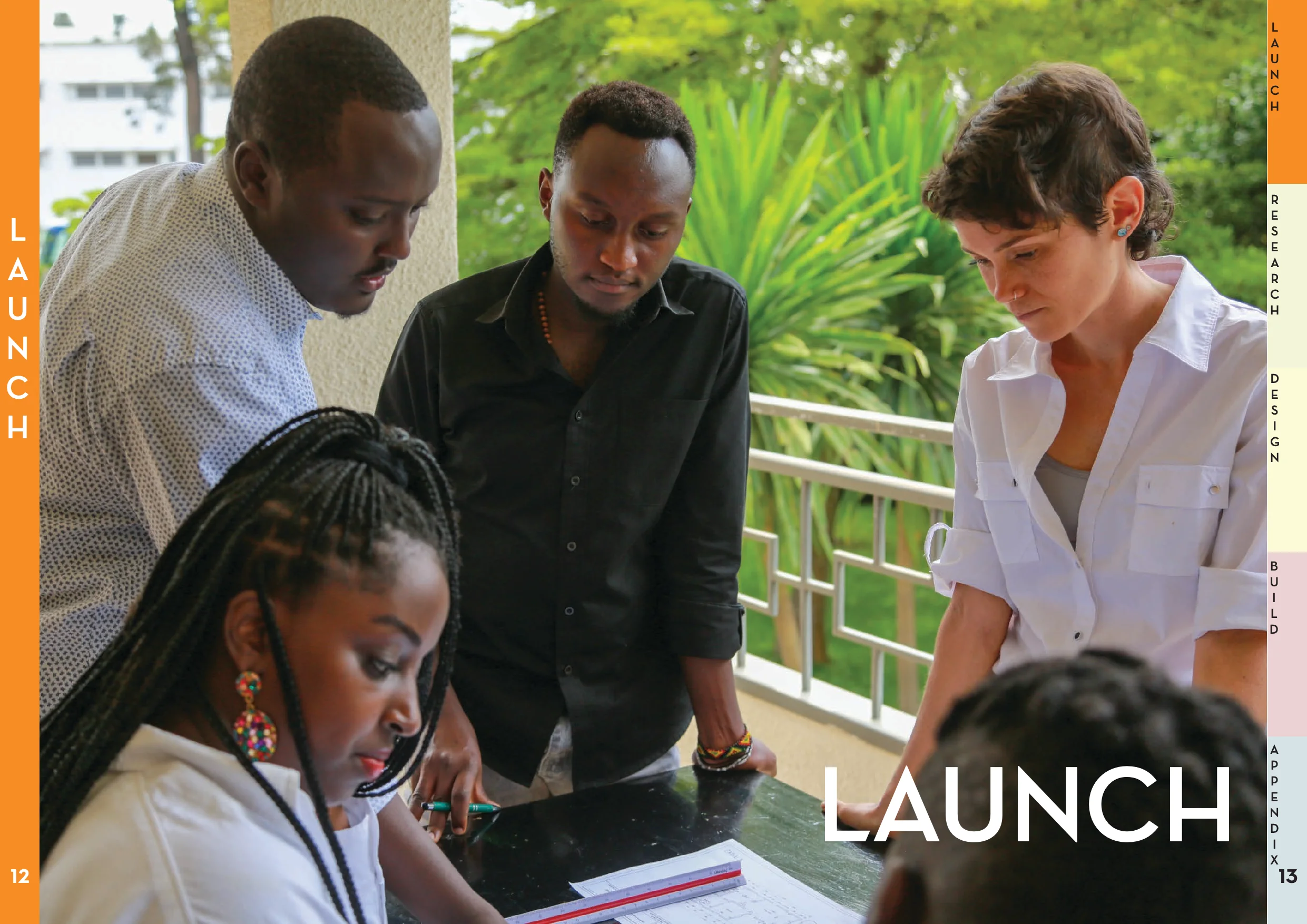 Local partners and a volunteer designer reviewing project drawings together