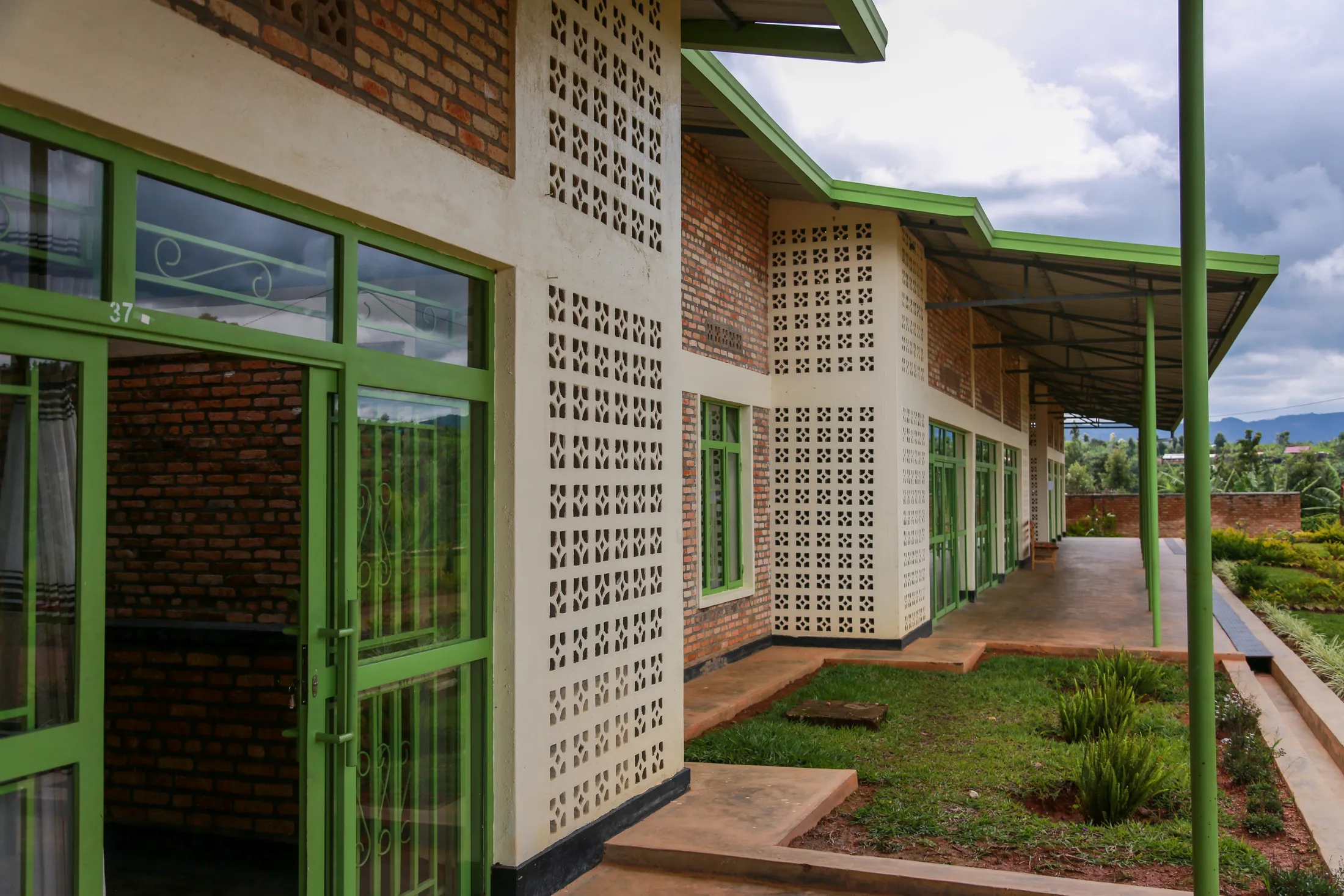 The accessible covered walkway and landscaped courtyard at the ASFA Physiotherapy and Rehabilitation Center in Rwanda