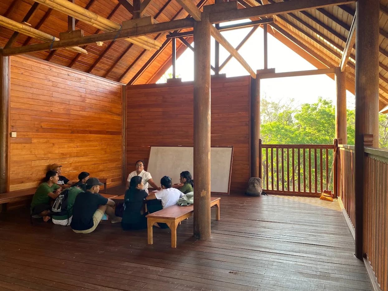 A community meeting inside Suwandi Primary School's locally built timber interior in Bali