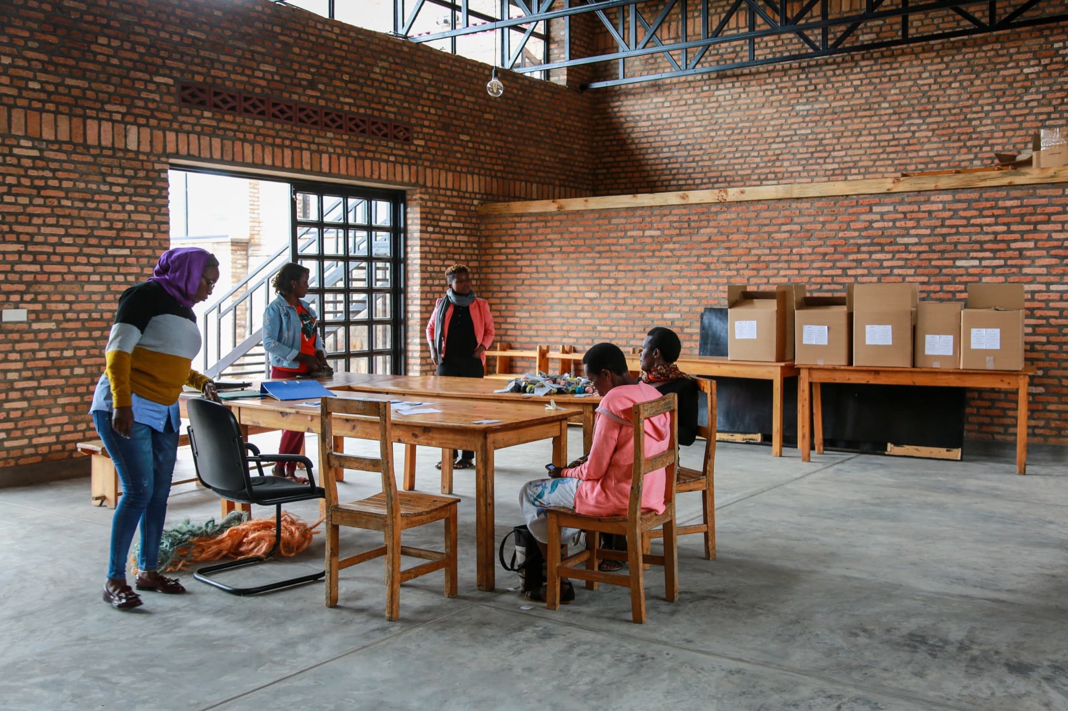 Community members working together inside a completed Journeyman-designed facility