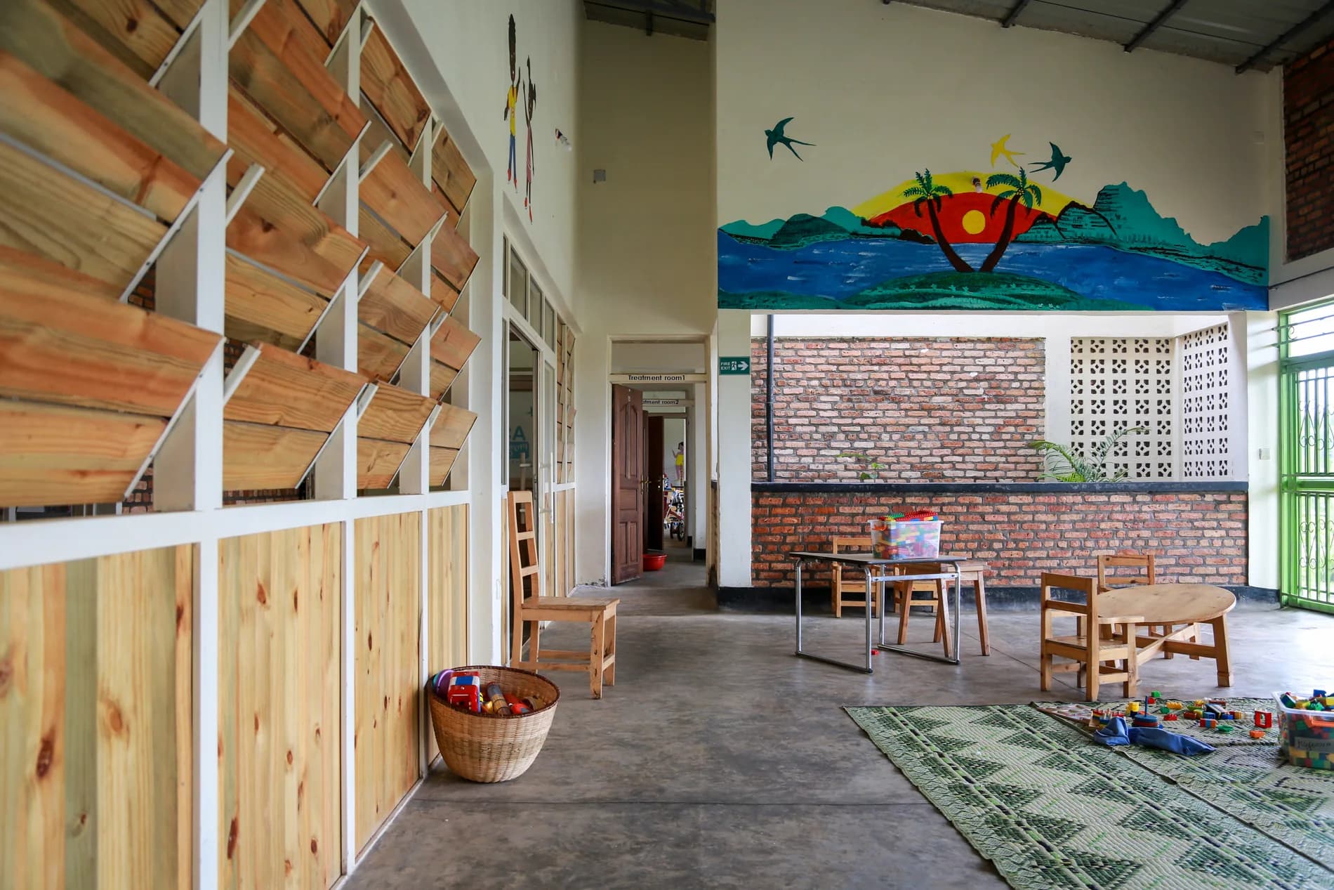 A bright child-scaled play and treatment area inside the ASFA rehabilitation center