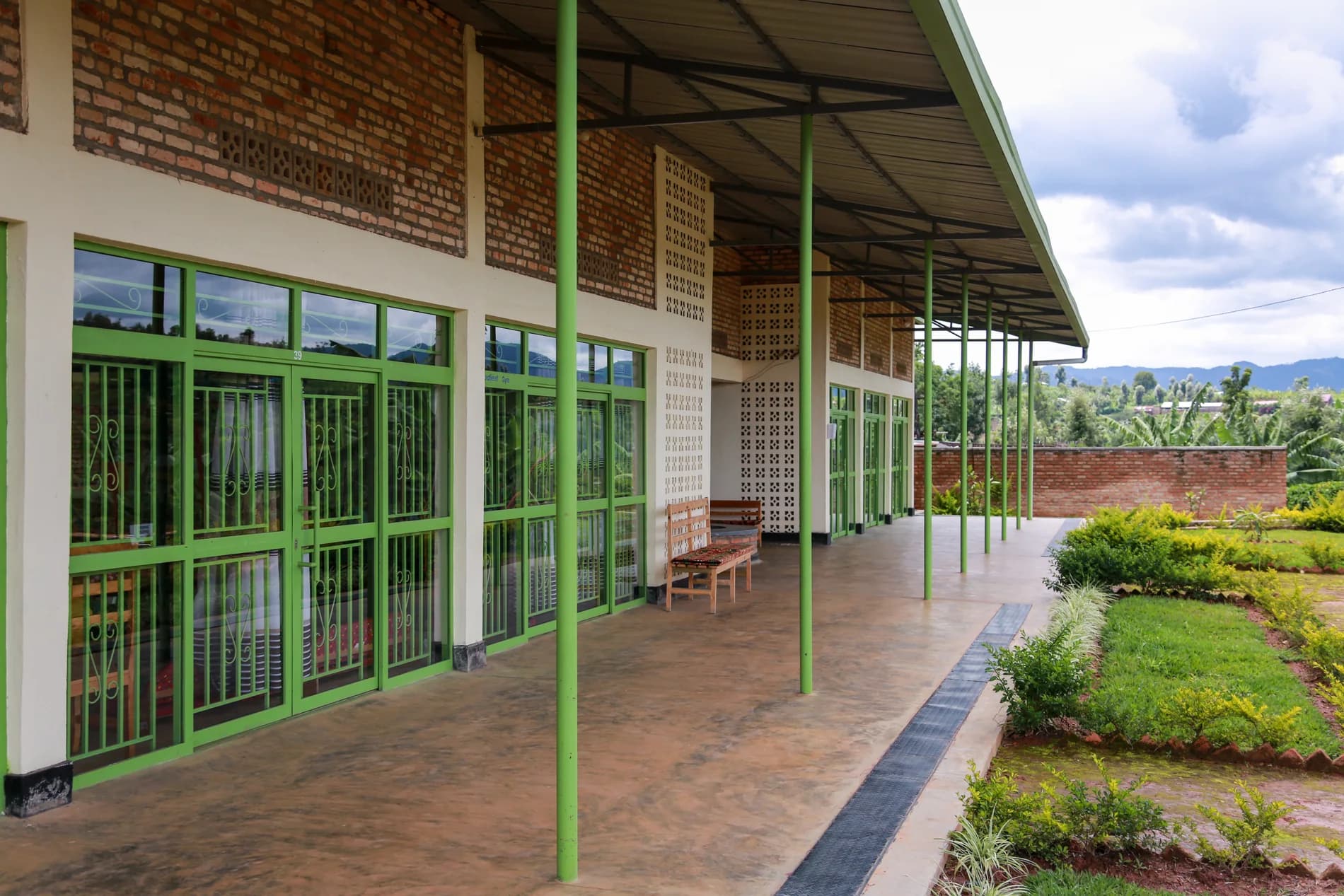 A sheltered veranda connecting treatment rooms with the gardens at the completed ASFA center