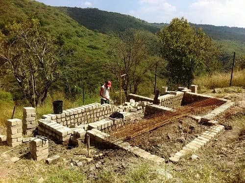 Masonry construction underway on Horizon Mexico's wooded hillside site