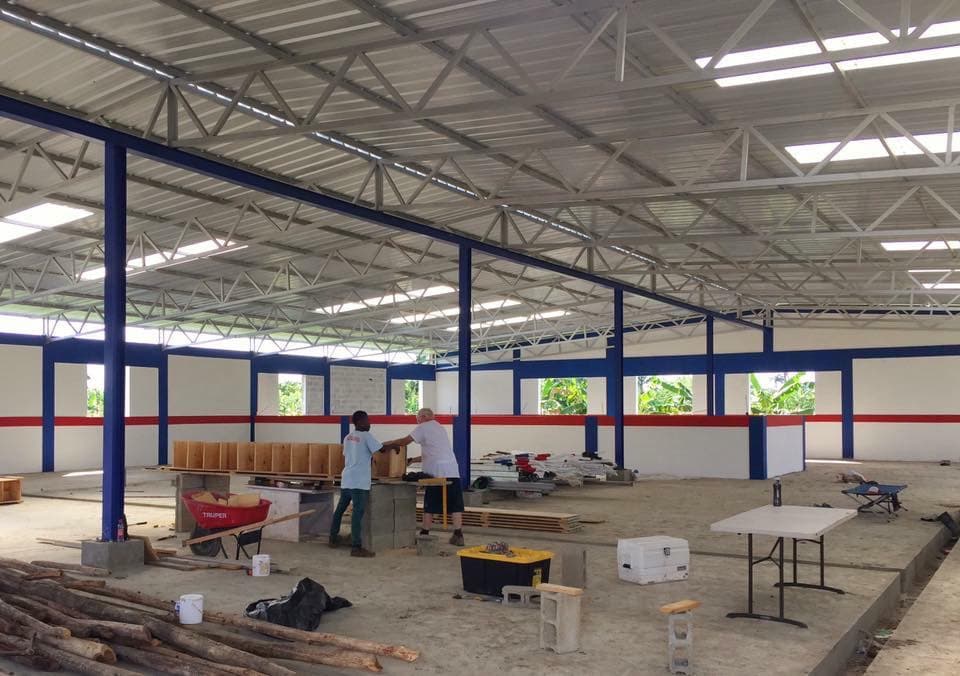 Interior fit-out underway inside a large M2535 workshop with a steel frame and naturally lit roof
