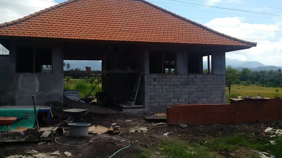 PUSPADI Library under construction, with the terracotta roof complete and masonry walls still being built