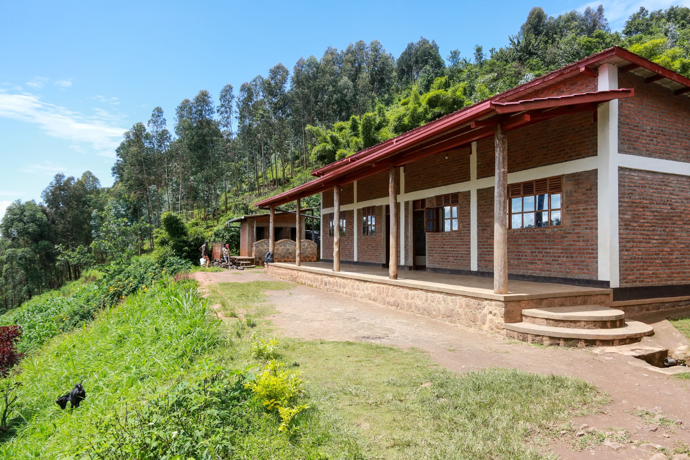 The completed Sunzu Village library on its green hillside in Burera, Rwanda