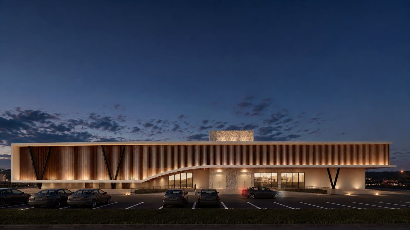 Nighttime architectural rendering of the proposed Ubumwe Arena entrance glowing beneath a deep blue sky